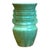 Crafted in the mid-20th century, this vibrant ceramic vase features a robust, architectural silhouette highlighted by...