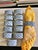 A vintage set of 12 Williams Sonoma porcelain napkin rings with a blue and white lattice pattern. The classic chinoiserie-...