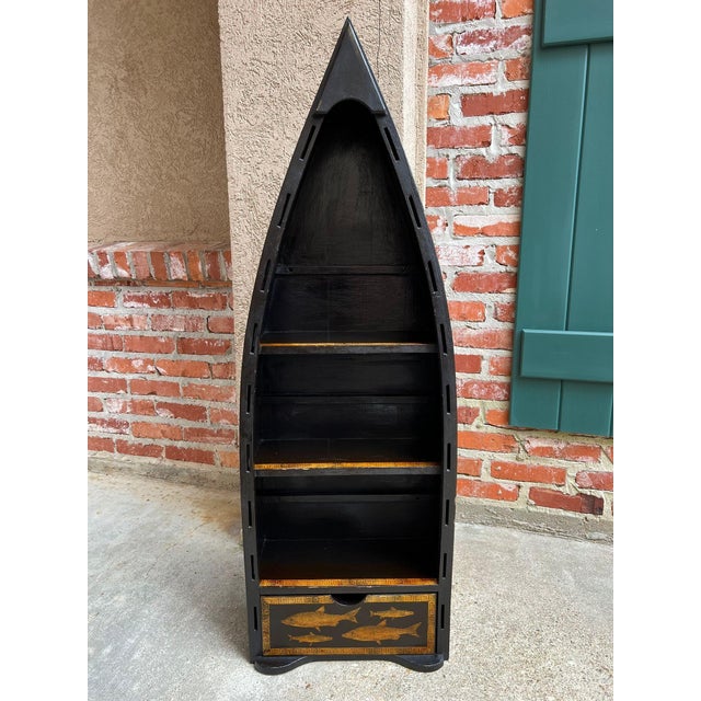 English Boat Form Etagere Black Lacquer Fish Decoupage Collection Bookshelf. Direct from England, a striking boat-form...