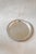 A large round silverplate tray framed by a twisted rope border, with a plain center that shows a soft, lived-in patina....