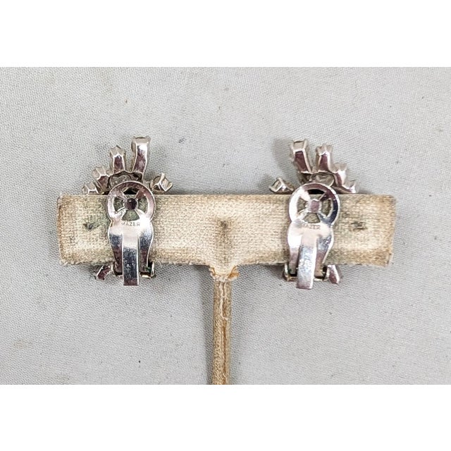 1950s rhodium plated clear marquise, baguette & round rhinestone clip earrings. Marked "MAZER" on the clips. Measure: 1...