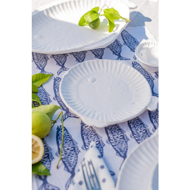 Playing off the handpressed edges of Pietra Serena, the Pesca Serena Round Platter has charming fish details to create a...