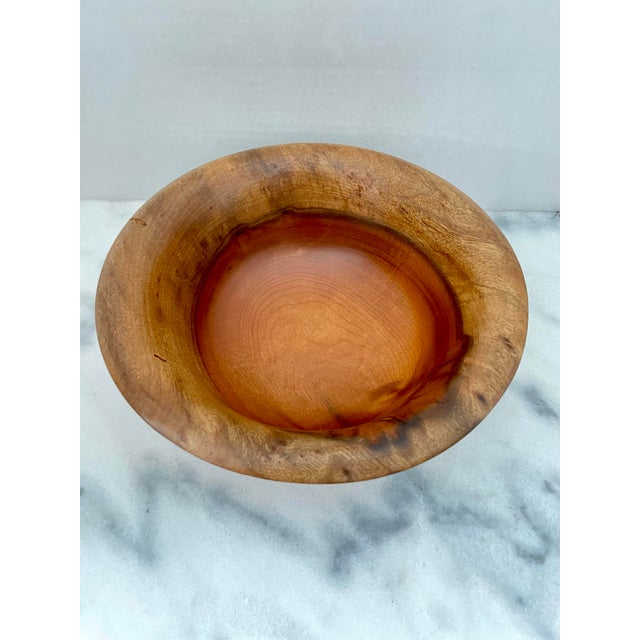 A beautifully crafted Myrtlewood bowl with attractive contrasting light to dark wood grain. The bowl is marked,...