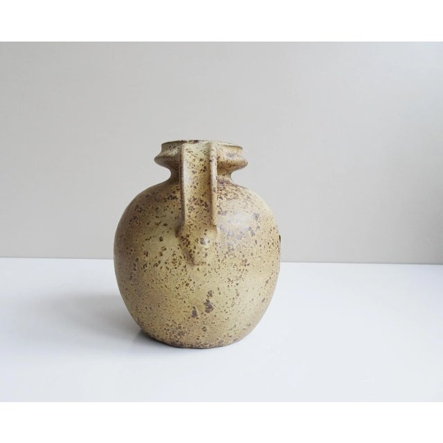 VK Studio Keramik from the 1960s / 1970s. The Velus Vase convinces in its timeless shape and the natural glaze in brown...