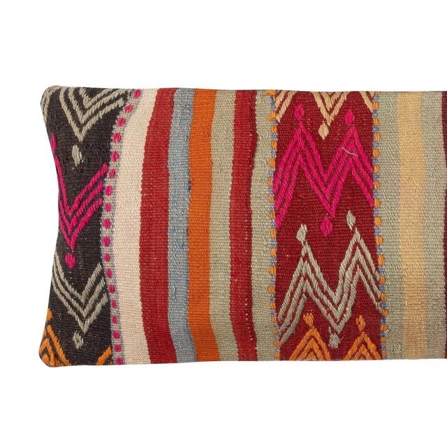 Add a touch of history and warmth to your space with this vintage handmade Turkish wool kilim cushion cover. Crafted from...