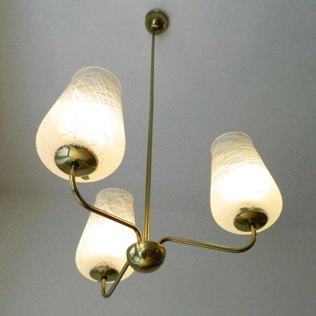 Very nice vintage ceiling lamp with three flower-shaped glass shades with line decoration. The lamp has three sockets for...