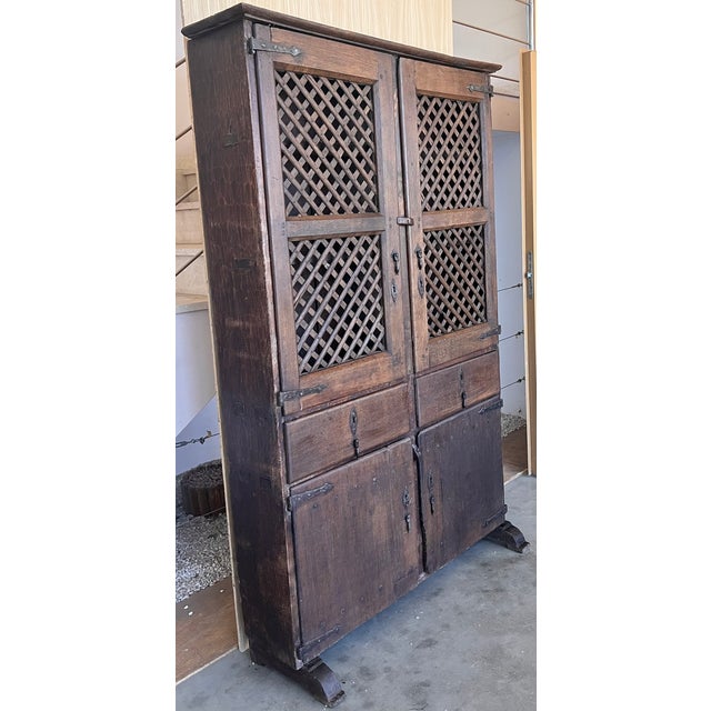 19th century Spanish cupboard or buffet constructed from walnut. Features a two parts with four doors . This massive...
