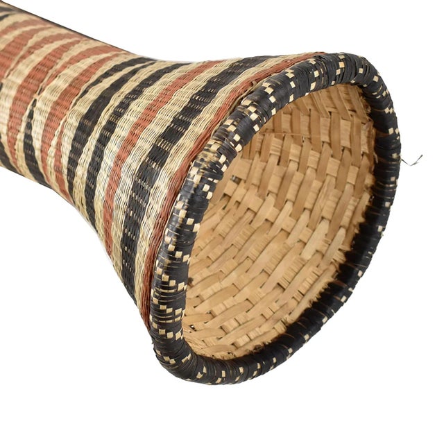 The Tutsi Wedding Basket Vase is a unique and exquisite piece of art that originated from the African country of Rwanda....