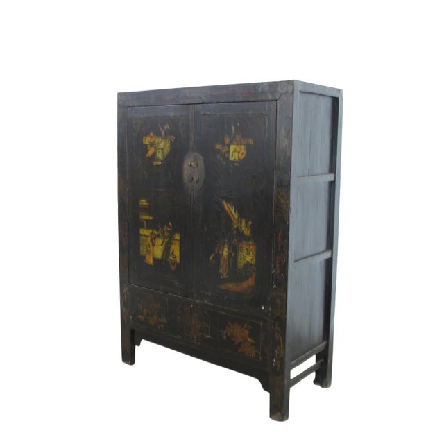 The two panels door of this black Chinese Chinoiserie cabinet is adorn with hand painted the opera actors performing on...