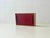 A characterful mid-century wall cabinet from the 1950s to 1960s with a clear, functional design. The warm-toned wooden...