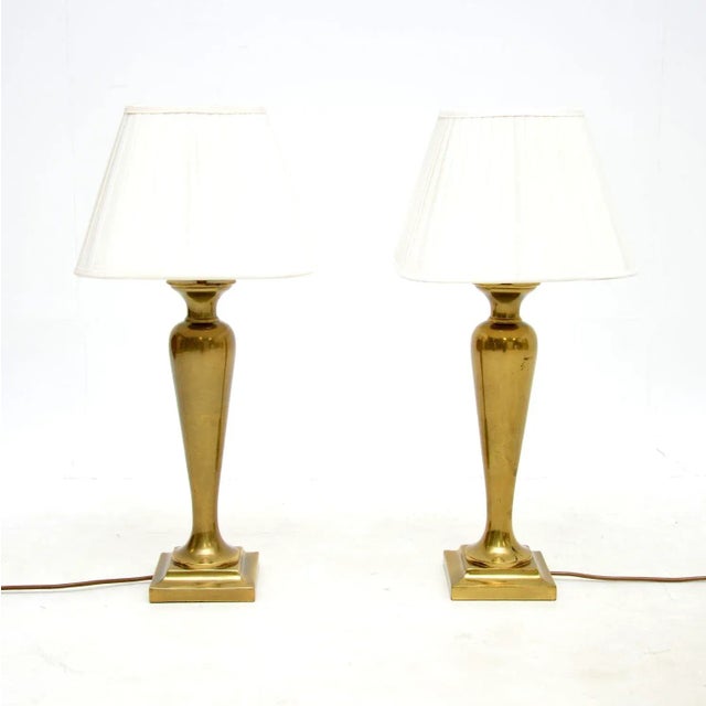 A stylish and very well made pair of vintage solid brass table lamps. They were made in England, they date from around the...