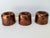 A charming set of three antique English copper culinary moulds, probably Victorian. Their substantial construction and...