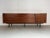 Large modernist sideboard produced in Belgium around 1960. Nice minimalistic design made of teak wood combined with a...