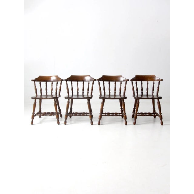 This is a set of four vintage Richardson Brothers chairs. The pub style dining chairs are solid oak and have turned splay...