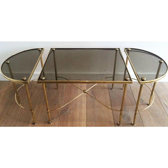 Circa 1940 Maison Bagues Tripartite Brass Coffee Table with Smoke Glass. Dimensions of the middle table: L 23 7/8" W: 20"...