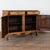 20th century French oak sideboard featuring traditional provincial carved panel doors and scalloped skirt. Two narrow...