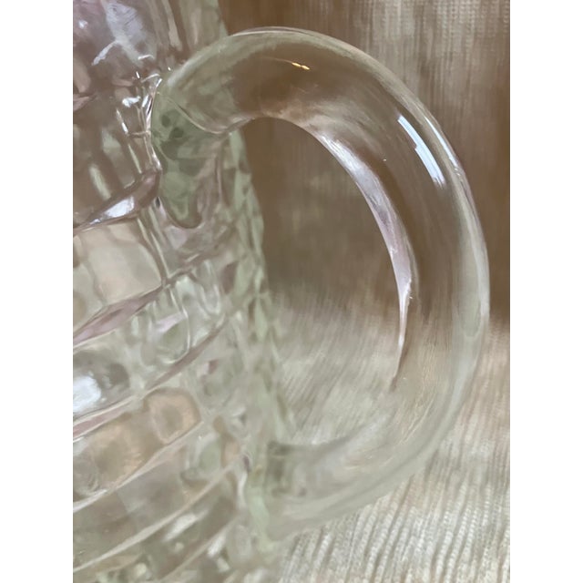 The pitcher is “Fosteria” 1950 “ & there are eight “Mid-Century” Dorthy Thorpe Silver Rimmed Water Glasses.