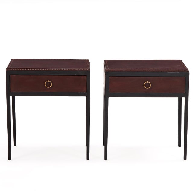 A striking pair of contemporary Argentine nightstands, masterfully crafted with rich brown leather-clad cases enclosed...