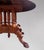 Mahogany pedestal table with a band resting on four legs supported by four columns. The table can be extended by you using...