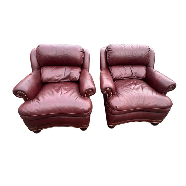 Nice pair of Hancock Moore lounge chairs with 1 matching ottoman. Made with genuine leather and nailhead trim. The 1...