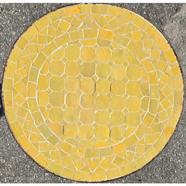 Add a touch of charm to any space with this handcrafted mini mosaic accent table. Featuring a round yellow mosaic tile top...