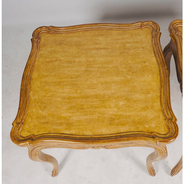 This elegant pair of end tables by Judson Rothschild beautifully captures the timeless sophistication of Italian Rococo...