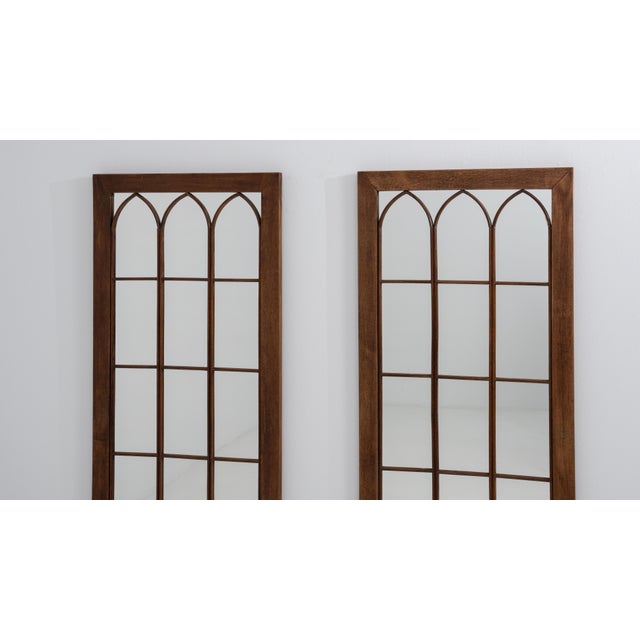 A coordinated pair of mirrors designed to bring symmetry and depth to a space, featuring classic oak frames with...