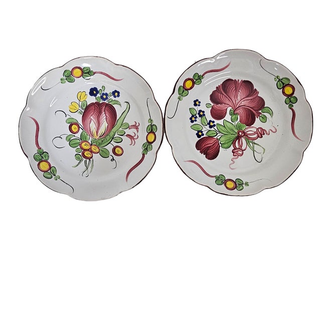 This set of two ceramic plates reflects the Les Islettes faience tradition associated with historical pottery centers in...