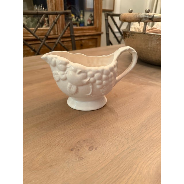 Vintage white gravy boat with fruit design will hold lots of gravy or sauce at your next festive dinner.