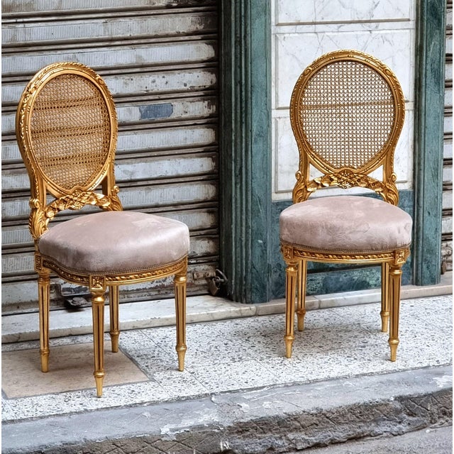 Bring refined French elegance to your interior with this beautifully crafted Louis XVI-inspired chair set. It features a...