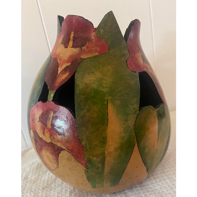 This sculptured art gourd is by Arizona artists Steve and Mary Schneck. Any way it’s turned shows stunning fuchsia and...