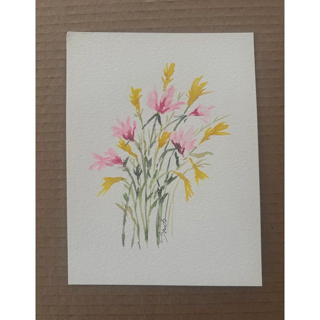 This delicate composition features soft pink and golden yellow blooms in a loose, elegant arrangement. Minimalist yet...