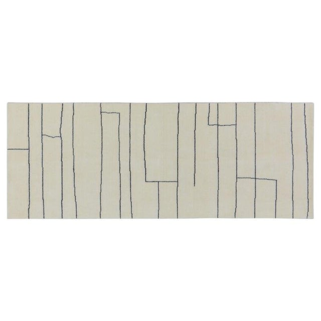 Hand-knotted with care using traditional rug-making techniques, this wool rug blends timeless craftsmanship with a modern...