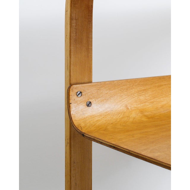 A rare and early Finnish mid century modern wooden sculptural side table model "915 / 75" in stained and form pressed...