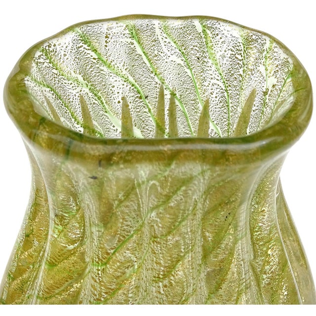 Beautiful vintage Murano hand blown thin green stripes and gold flecks Italian art glass flower bud vase. The piece is...