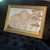 Gorgeous midcentury modern decorative wall mirror; painted trees in gold makes this a piece of art as much as it is a wall...