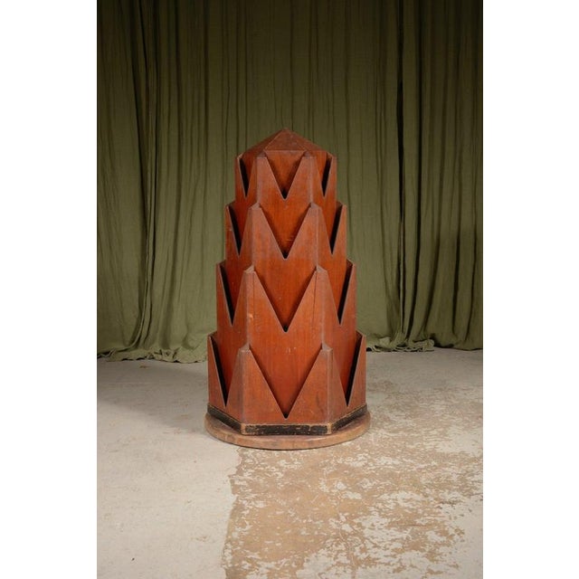 A rare and stylish Art Deco revolving shop display stand, of hexagonal form in mahogany with graduated slots all the way...