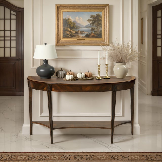 Aesthetically transfixing, this glorious console table is a true statement piece with its unique demilune design. Crafted...