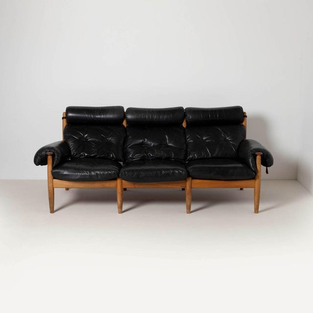 Brazilian style Three-Seater Sofa by Eric Merthen for Ire Möbler, Sweden, 1960s Made of oak wood and black leather....