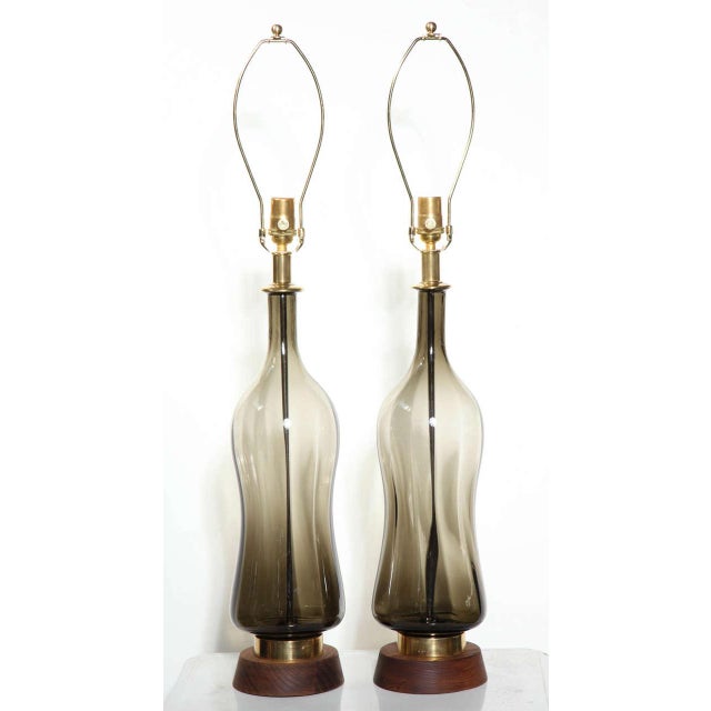 Tall Pair of Earthen Toned Glass Translucent Table Lamps attributed to Blenko Glass Co. Featuring a hand sculpted...