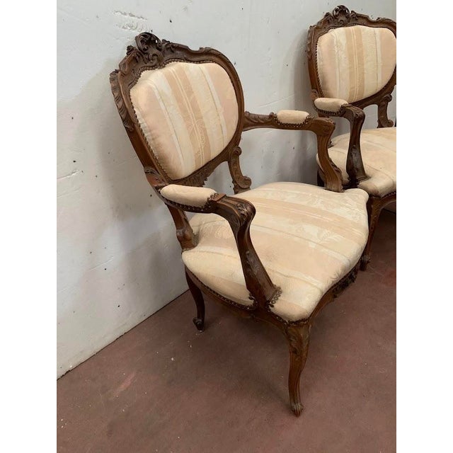Pair of louis xv style armchairs medallion backs solid walnut frame cabriole legs with scrolled feet high-quality carving...