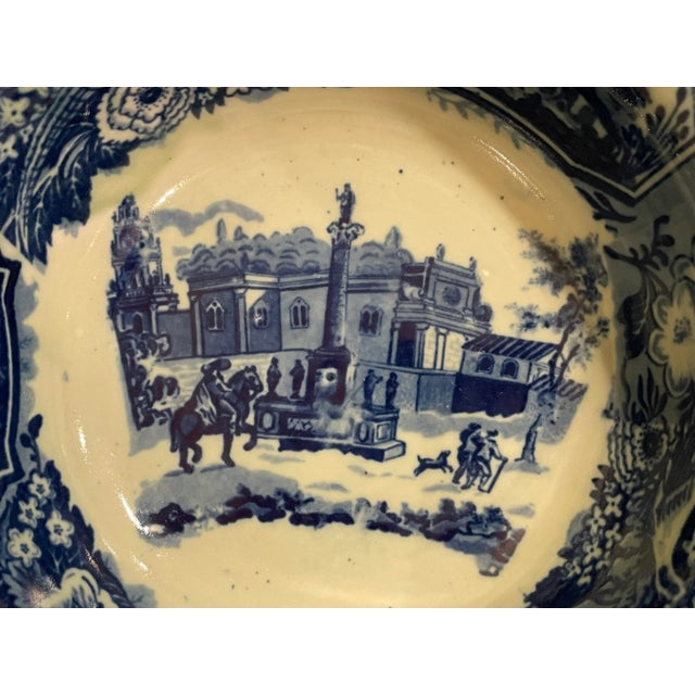 Large flow blue style bowl by Victoria Ironstone with classic European scenes, birds and flowers on the inside and out....