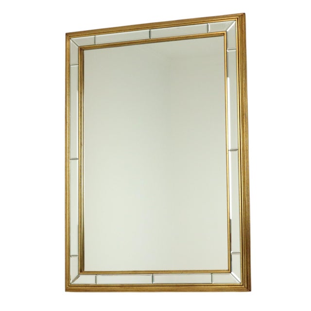 Large vintage rectangular Deknudt mirror with beveled side panels and gold-colored accents all around, entirely in...