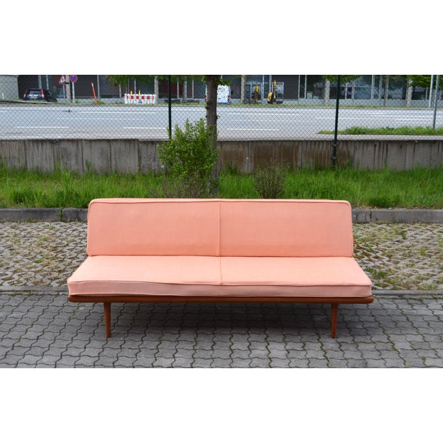 Minerva daybed, designed by Peter Hvidt and Orla Mølgaard-Nielsen for France & Søn. The daybed features an elegant solid...