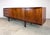 A gorgeous long and low mid century modern credenza in rosewood by A. H. McIntosh & Co Ltd, Kirkcaldy, Scotland circa...