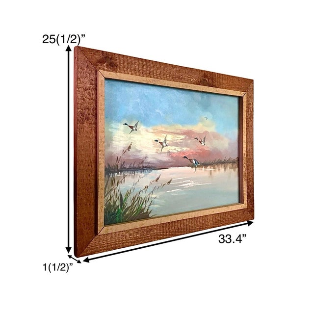 This vintage painting depicts a beautiful scene of mallard ducks in flight over a tranquil lake, capturing the essence of...