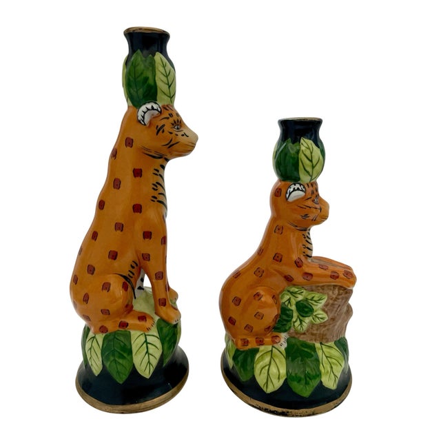 The CBK LTD Porcelain Jungle Cat Candlestick Holder is a unique and stylish decorative collectible piece featuring a...