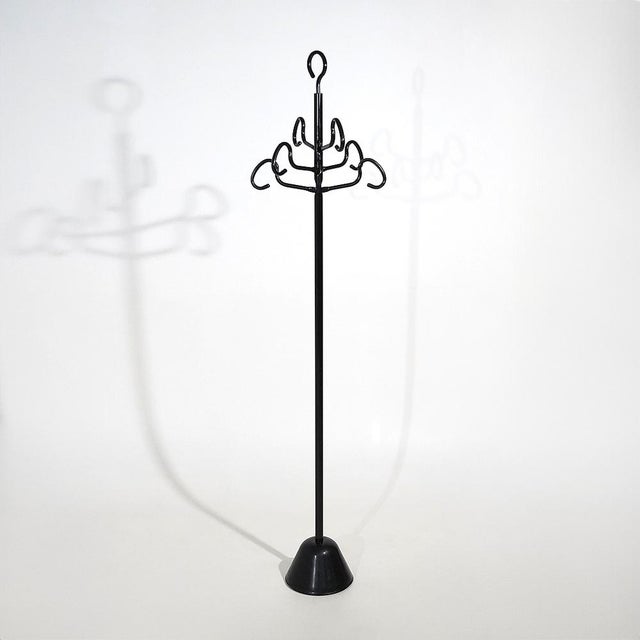 A “Servomanto” coat stand designed by Achille Castiglioni for Zanotta in the 1980s, characterised by a vertical black-...