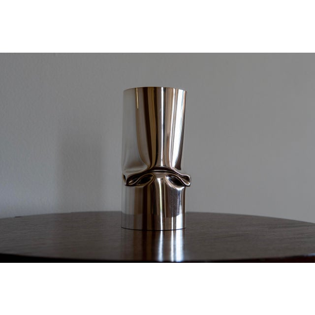 A striking modernist vase by the renowned French luxury house Christofle, showcasing the brand's signature blend of...