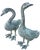 A striking pair of life-size cast metal geese sculptures with beautifully detailed feathering and a rich green verdigris...